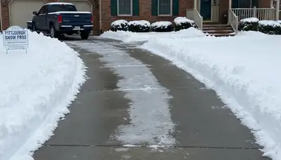 Cleared driveway after professional snow removal by Chop Chop Landscaping in Pittsburgh, PA