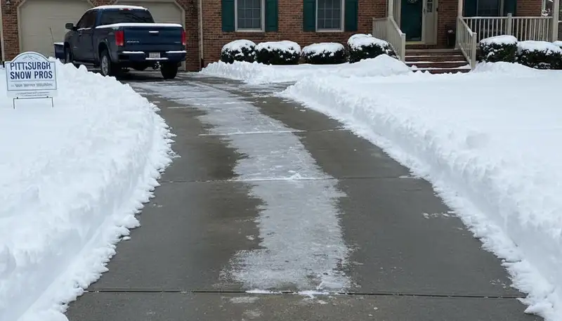 Cleared driveway after professional snow removal by Chop Chop Landscaping in Pittsburgh, PA